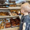 young boy picking a doughnut at Chuck's Donut, a doughnut shop near Seattle with delicious flavors