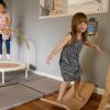 young girls jumping and balancing in an indoor play space at The Village Project in North Bend