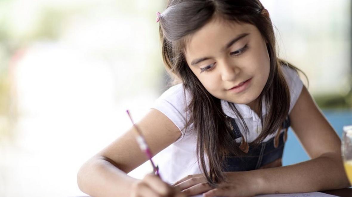 Young girl writing