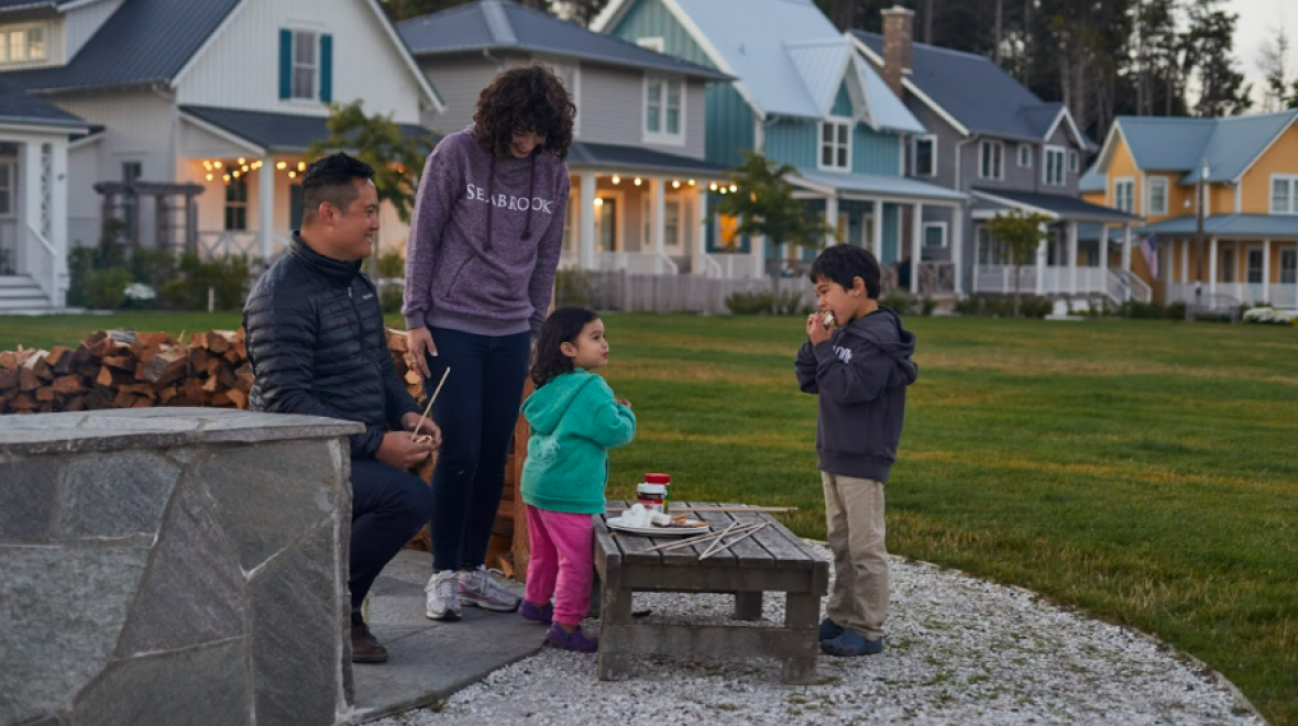 Mom, dad, son and daughter roasting s'mores at Seabrook