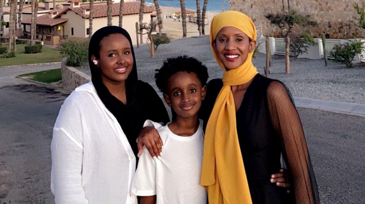 Kent mom Shurki Olow (far left) stands for a portrait with her daughter and son.