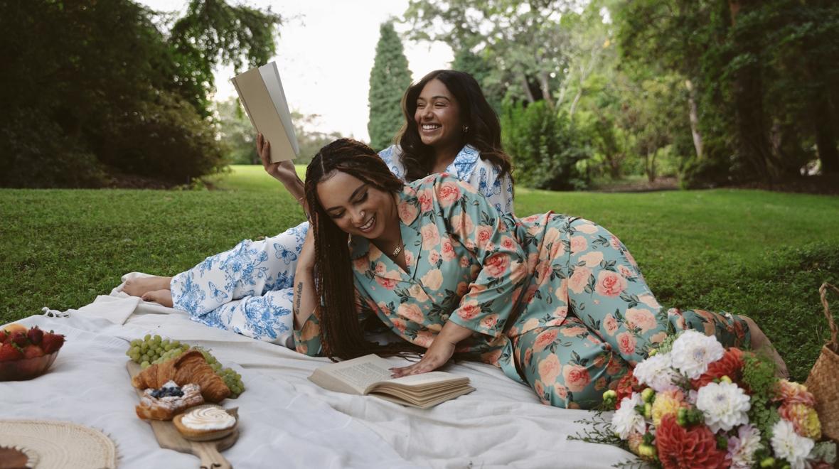 Two women relaxing in pajamas from a local seattle gift shop