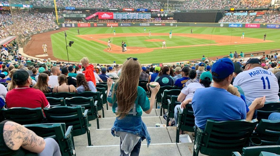 Girl walking down steps at T-Mobile Park to watch a Seattle Mariners Game