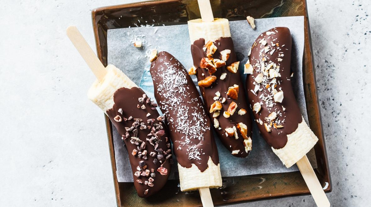 Frozen bananas dipped in chocolate and nuts are a great summertime treat