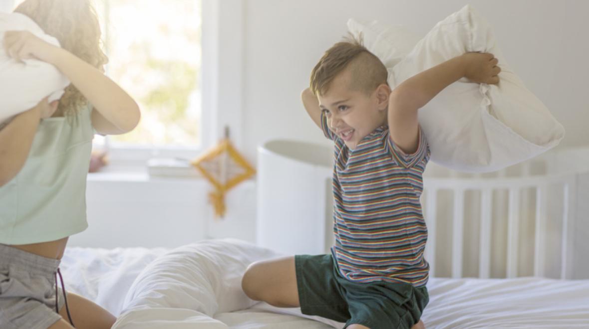 kids play pillow fight