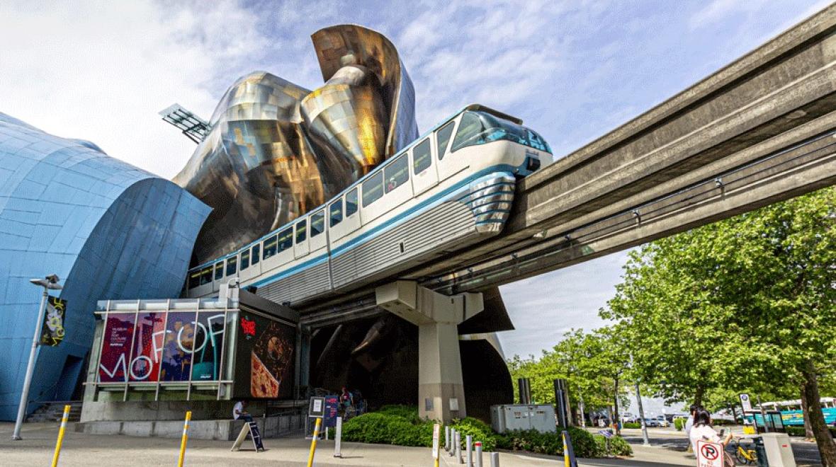 The Seattle Monorail on its track outside of MoPOP at Seattle Center, one of the best train adventures for families