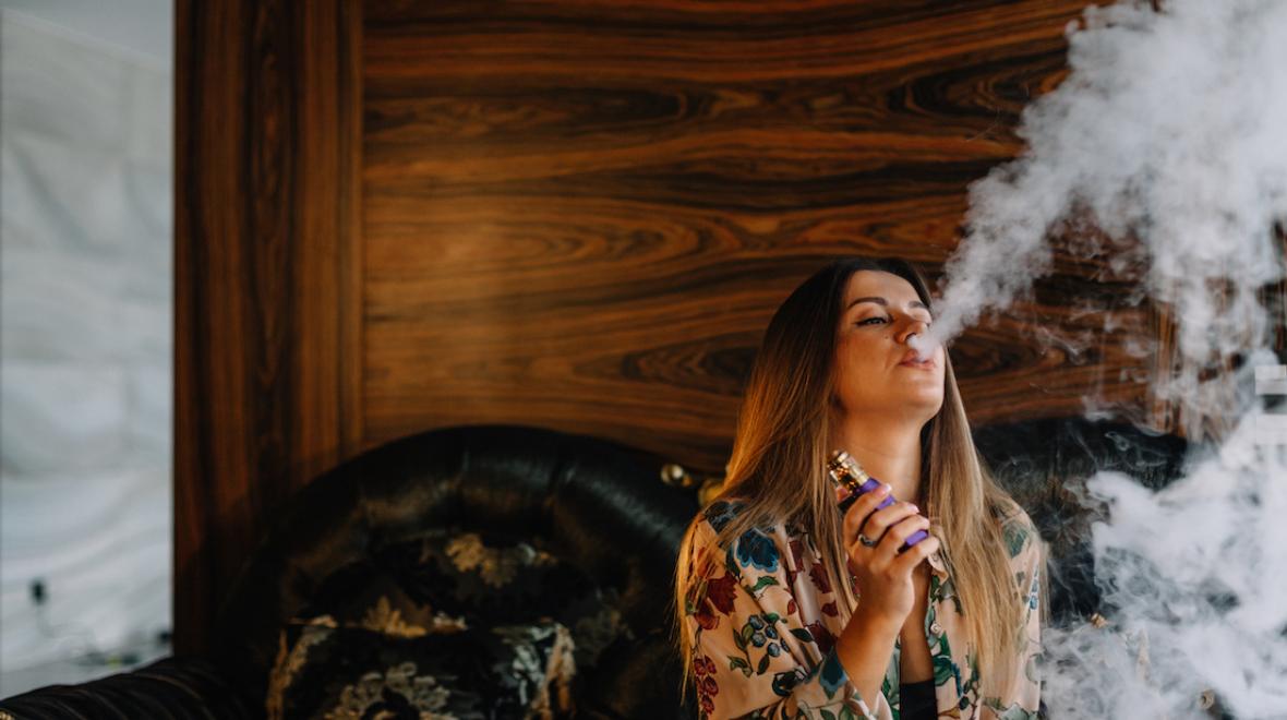 woman smoking cannabis at home