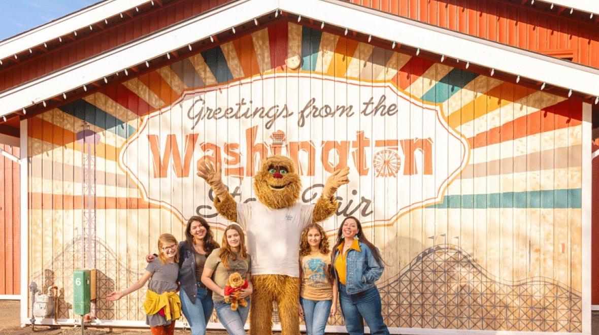 Family posing outside the Washington State Fair in Puyallup