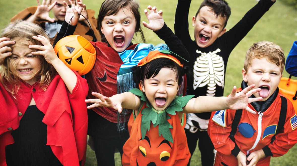 children trick or treating in Halloween costumes