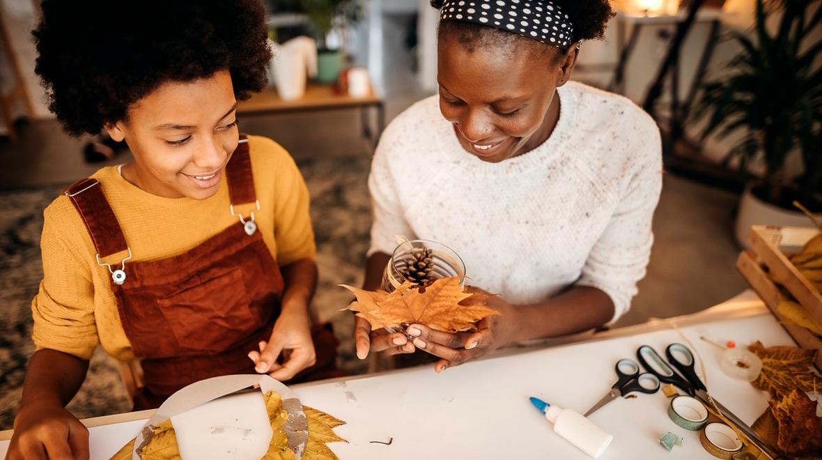 mom and child working on Thanksgiving crafts