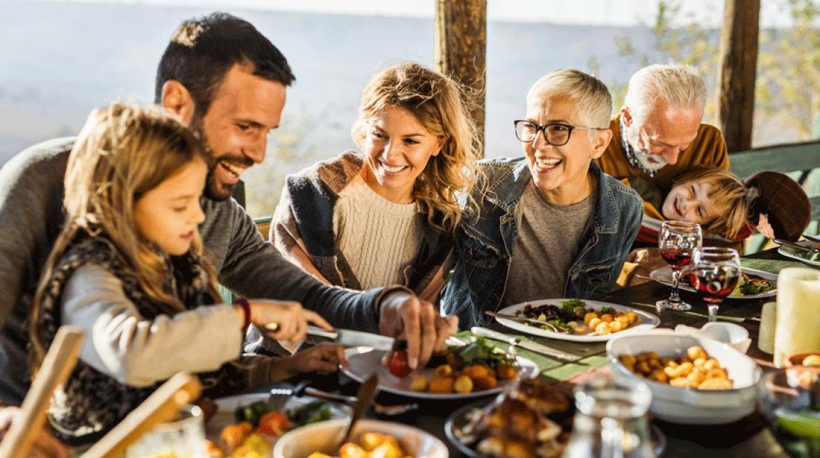 family enjoying a takeout Thanksgiving meal from local restaurants in the Seattle, Bellevue area serving Thanksgiving dinner