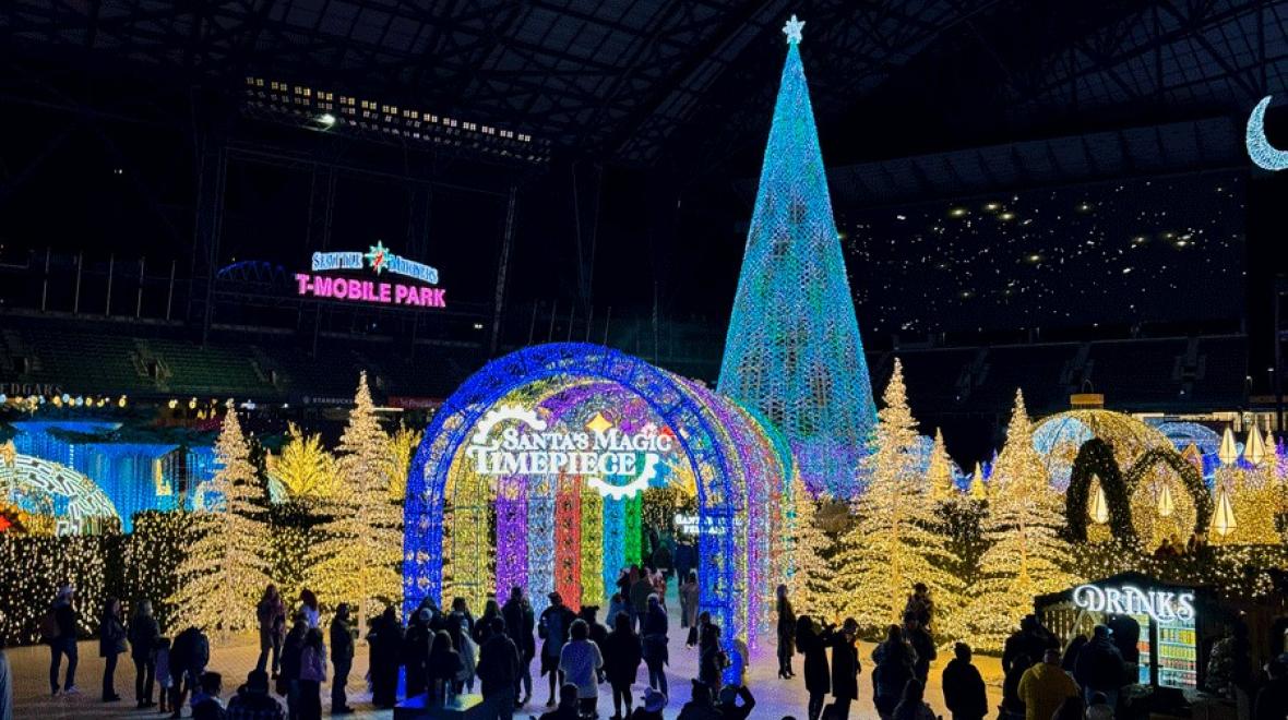 Enchant Christmas light maze entrance with Santa's Magic Timepiece theme, a holiday event in Seattle for families