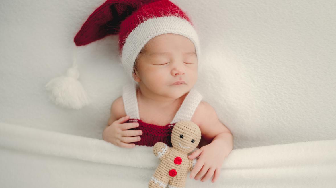 sleeping baby wearing a santa hat for a sweet and easy holiday photo