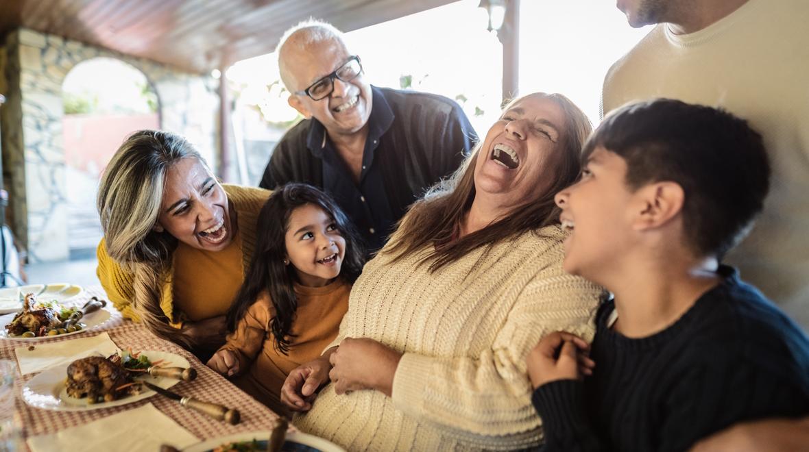 A family laughing and enjoying time together on Thanksgiving 