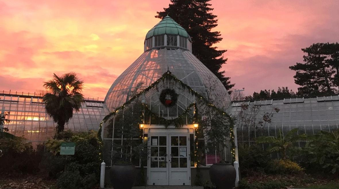 W.W. Seymour Conservatory in December at Sunset with holiday decorations, and a schedule full of Christmas activities for families