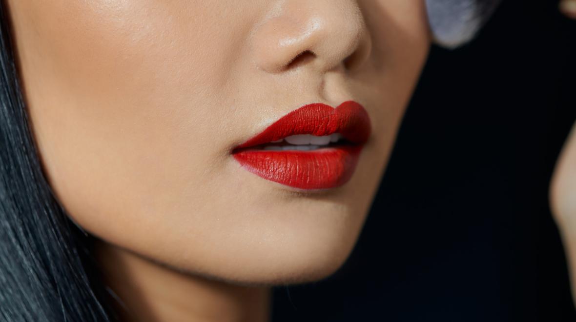 Asian woman wearing matte red lipstick