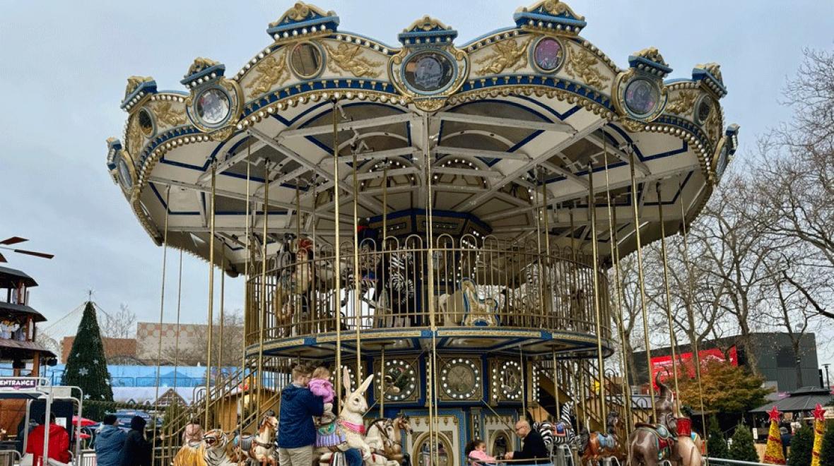 the double-decker carousel at Seattle Christmas Market, a fun family-friendly holiday attraction with Santa photo ops