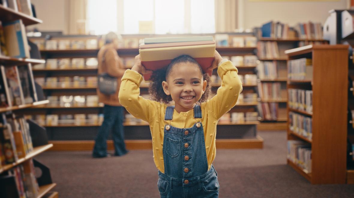 little girl having fun at the library 