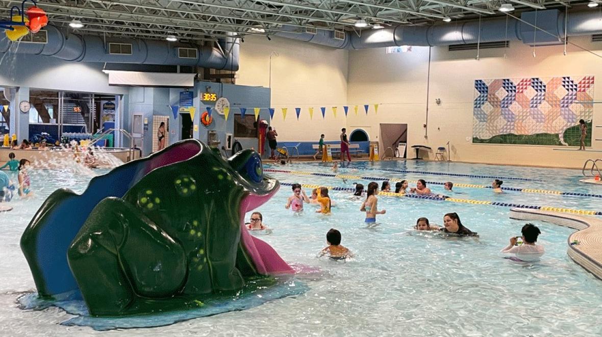 frog water slide at Bainbridge Island Aquatic Center, an indoor pool for Seattle-area families