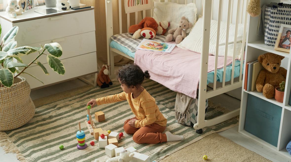 child playing in her bedroom