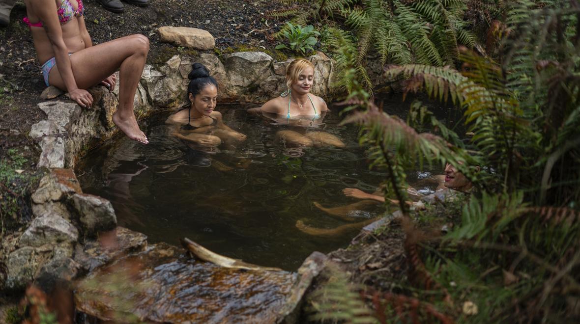 adults in a hot springs relaxing