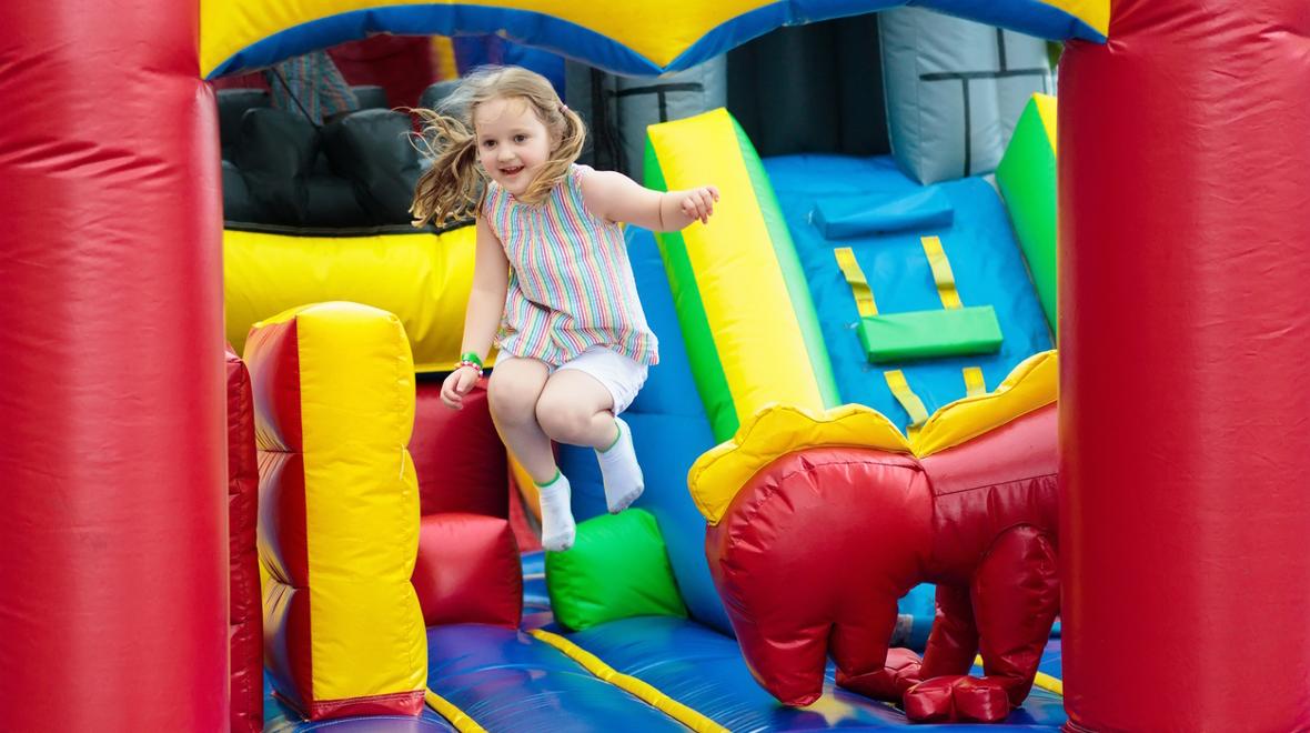 Child playing in a bounce house like Pump it Up