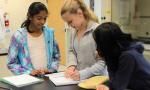 Eighth-graders work together on a science project. 