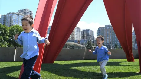 little boys running through the sculpture park by the Seattle Waterfront