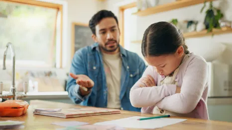 a dad tries to reason with his upset daughter, one gentle parenting tactic