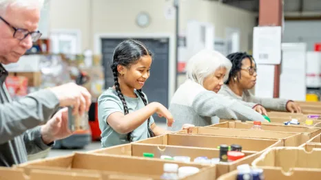 Girl organizing food donations during the holidays