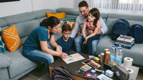 Family making a fire drill emergency plan together