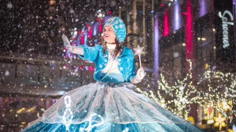 Parade princess at Bellevue's Snowflake Lane with falling snow, a nightly tradition and fun Christmas activity for Seattle-area families