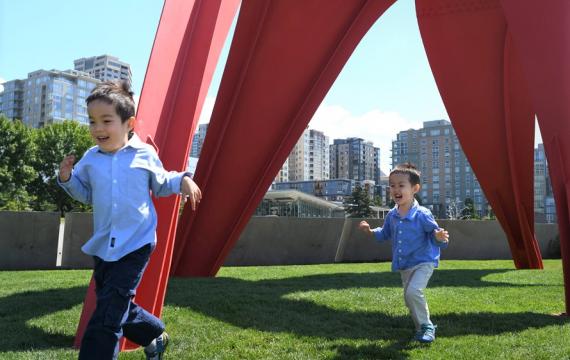 little boys running through the sculpture park by the Seattle Waterfront