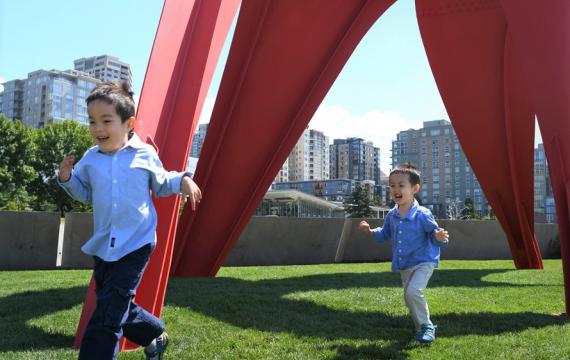 little boys running through the sculpture park by the Seattle waterfront