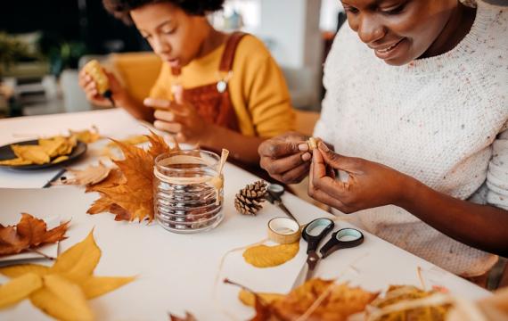 Mom and kid doing fall crafts for kids together