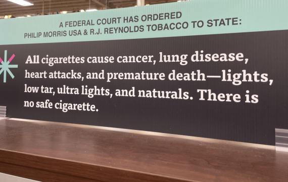 A large sign warning of the health dangers of smoking 