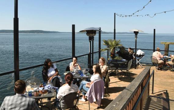 Families enjoying a meal at Duke's, a waterfront restaurant in Tacoma