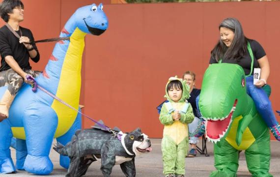 A family in costume at Volunteer Park's Halloween Pet Parade is a free thing to do in Seattle