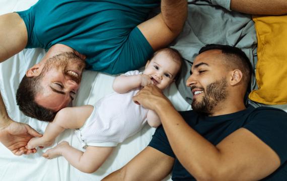 dads smile at their baby