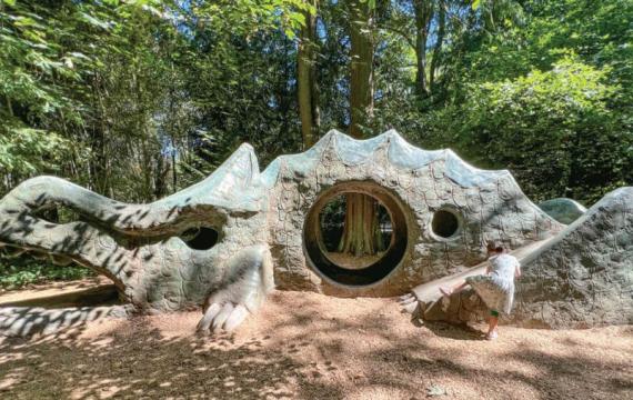 young girl climbing the dragon at Deane's Children's Park near Seattle, one of the many things for families to do this weekend