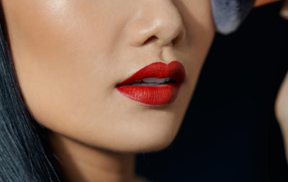 Asian woman wearing matte red lipstick