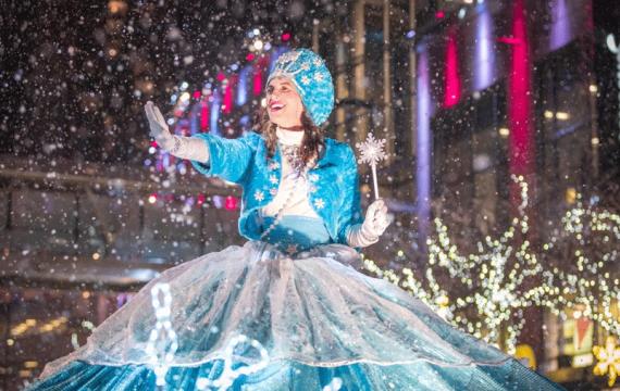 Parade princess at Bellevue's Snowflake Lane with falling snow, a nightly tradition and fun Christmas activity for Seattle-area families