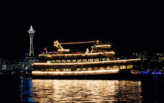 Argosy Christmas cruise ship on Elliot Bay with a view of the Space Needle, a fun Seattle holiday tradition for families