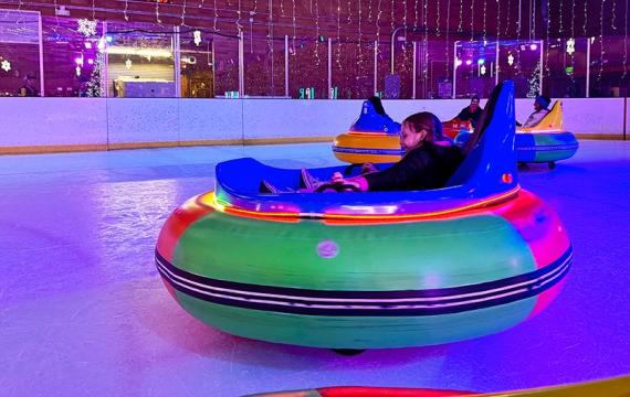 A kid spins in an ice bumper car at Sprinker Rec Center in Tacoma during ice lights