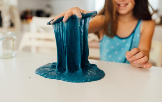 child playing with DIY slime