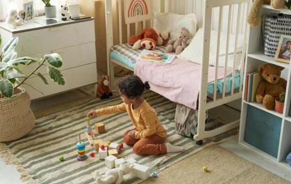 child playing in her bedroom