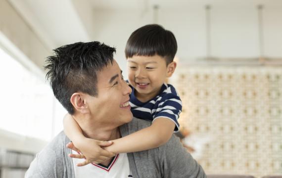 dad and son enjoying a hug