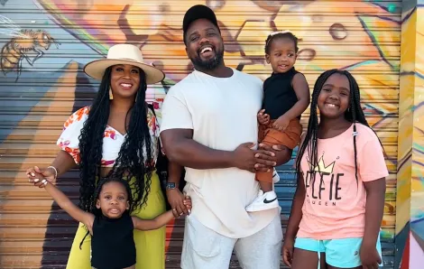 Local Instagram Influencer Tash Haynes stands for a portrait with her family in Tacoma, WA
