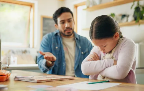 a dad tries to reason with his upset daughter, one gentle parenting tactic