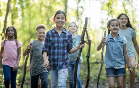 Kids walking through the woods